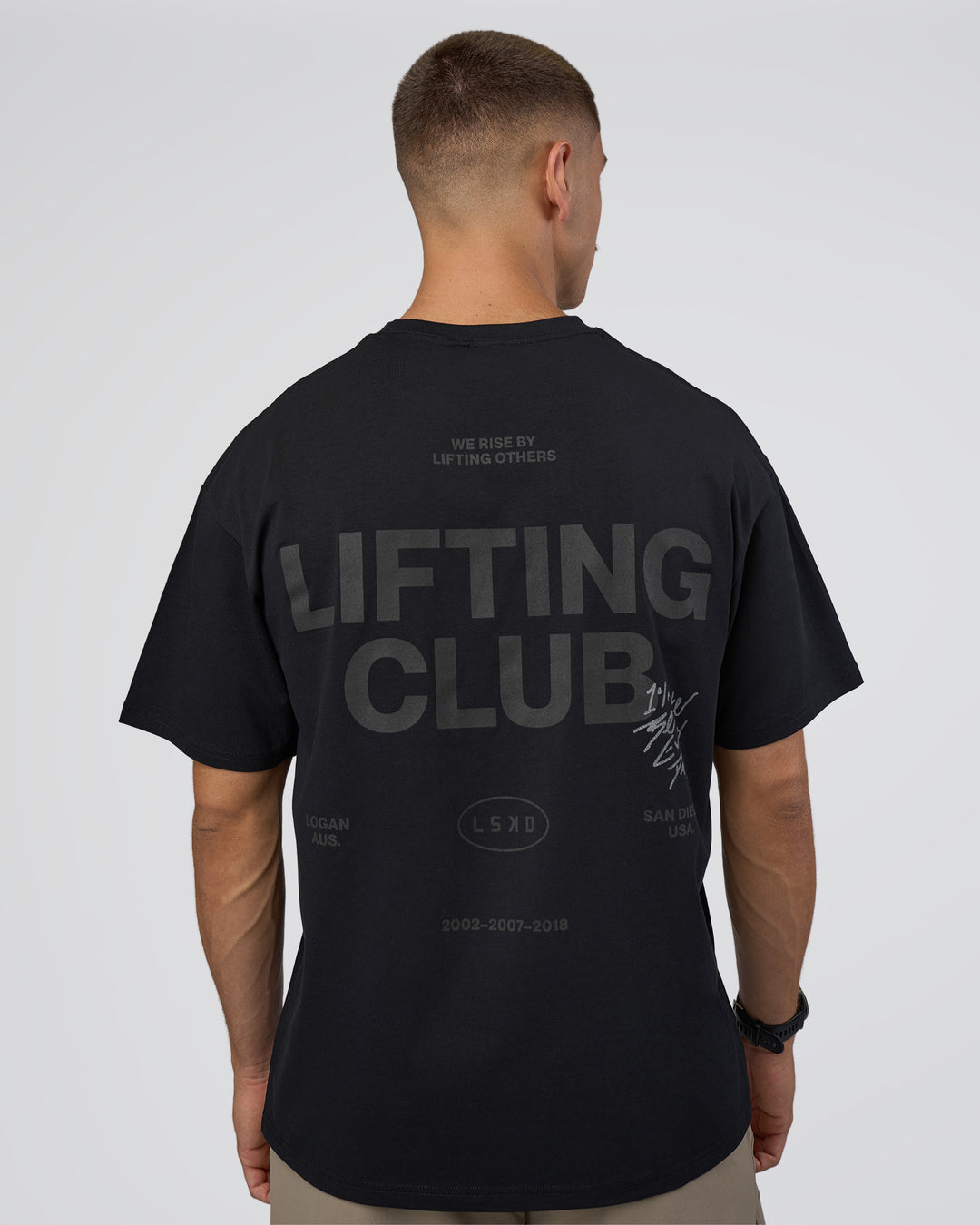Man wearing Lifting Club FLXCotton Tee Oversize - Black-Black | Model:Nikola | Size:L - view 3