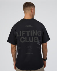 Man wearing Lifting Club FLXCotton Tee Oversize - Black-Black | Model:Nikola | Size:L | Thumbnail Index: 2
