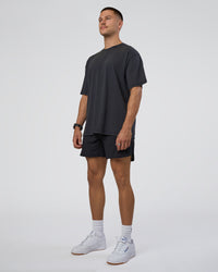 Man wearing Lifting Club FLXCotton Tee Oversize - Black Washed | Model:Nikola | Size:L | Thumbnail Index: 7