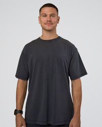 Man wearing Lifting Club FLXCotton Tee Oversize - Black Washed | Model:Nikola | Size:L | Thumbnail Index: 5