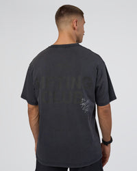 Man wearing Lifting Club FLXCotton Tee Oversize - Black Washed | Model:Nikola | Size:L | Thumbnail Index: 1
