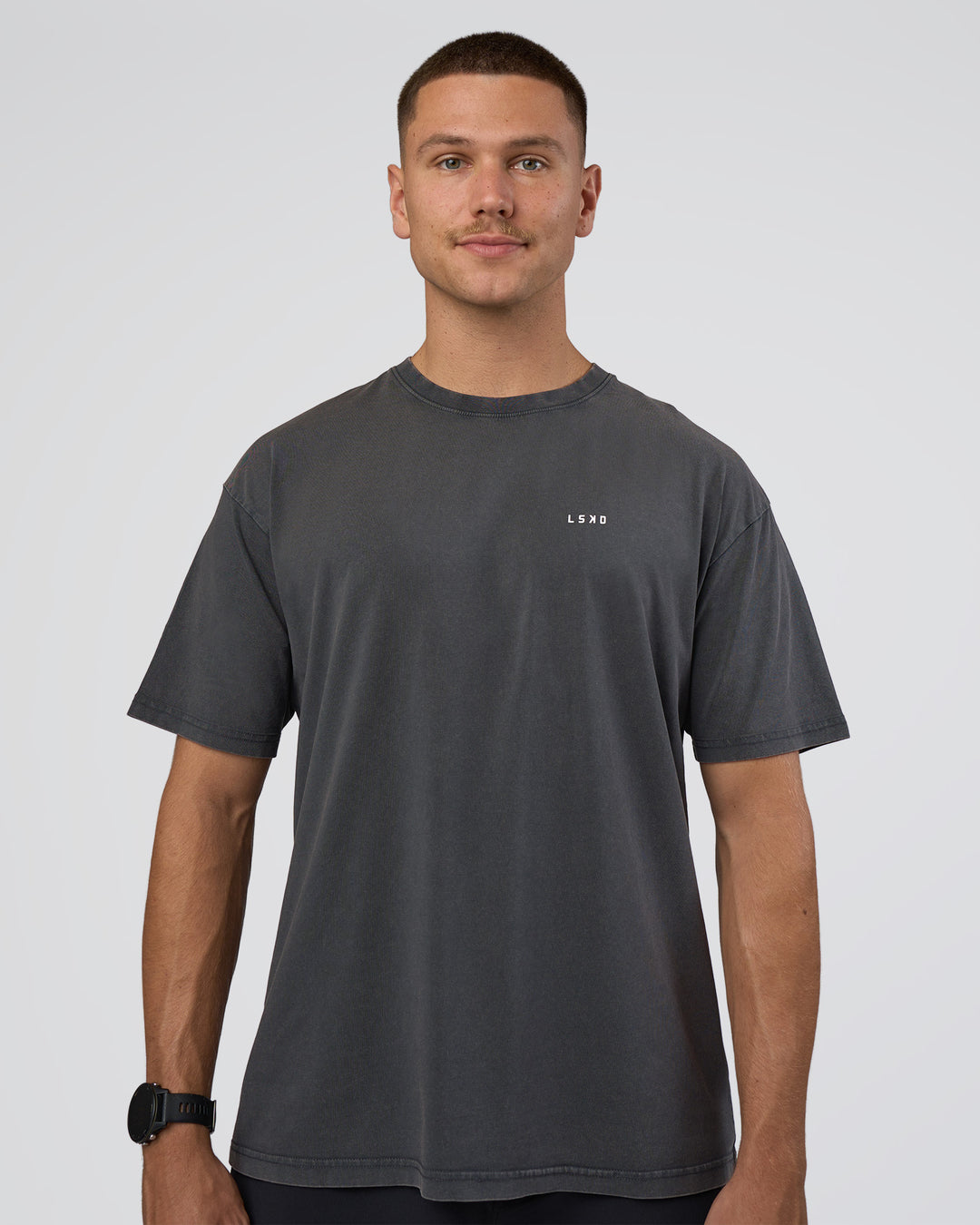Man wearing Lifting FLXCotton Oversized Tee - Black Washed-Flame | Model:Nikola | Size:L - view 2