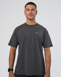 Man wearing Lifting FLXCotton Oversized Tee - Black Washed-Flame | Model:Nikola | Size:L | Thumbnail Index: 1
