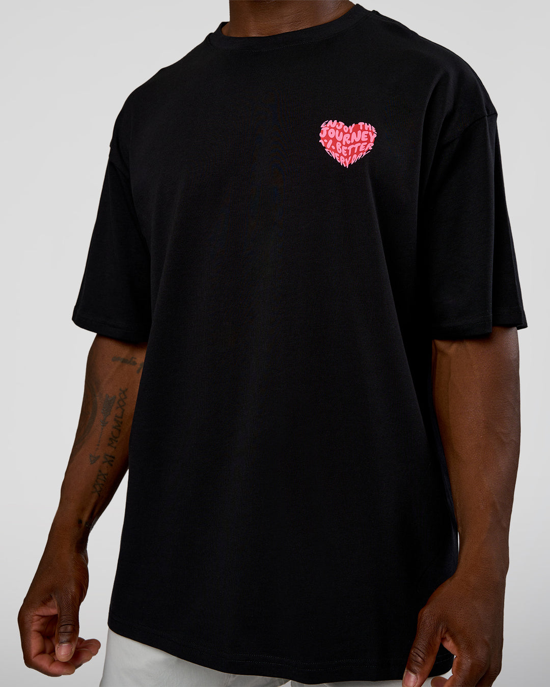 Man wearing Love the Journey FLXCotton Oversized Tee - Black-Flame | Model:Sam | Size:L - view 10