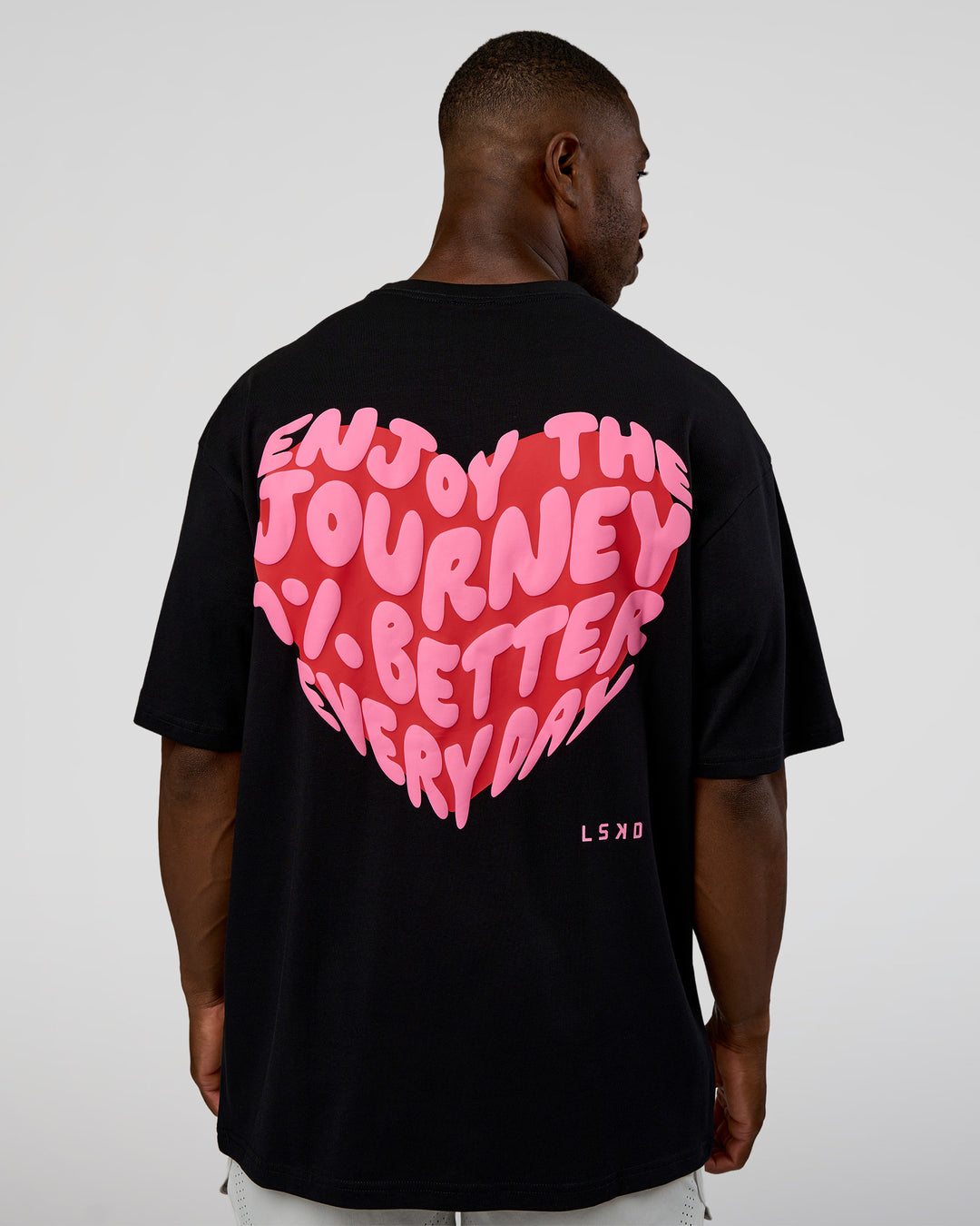 Man wearing Love the Journey FLXCotton Oversized Tee - Black-Flame | Model:Sam | Size:L - view 2