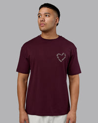 Man wearing Love The Process FLXCotton Oversize Tee - Cherry Lacquer-Shale Beige | Model:Kaelyb | Size:L | Thumbnail Index: 2