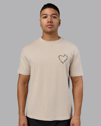 Man wearing Love The Process FLXCotton Oversize Tee - Shale Beige-Choc | Model:Kaelyb | Size:L | Thumbnail Index: 3