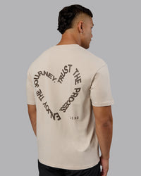 Man wearing Love The Process FLXCotton Oversize Tee - Shale Beige-Choc | Model:Kaelyb | Size:L | Thumbnail Index: 1