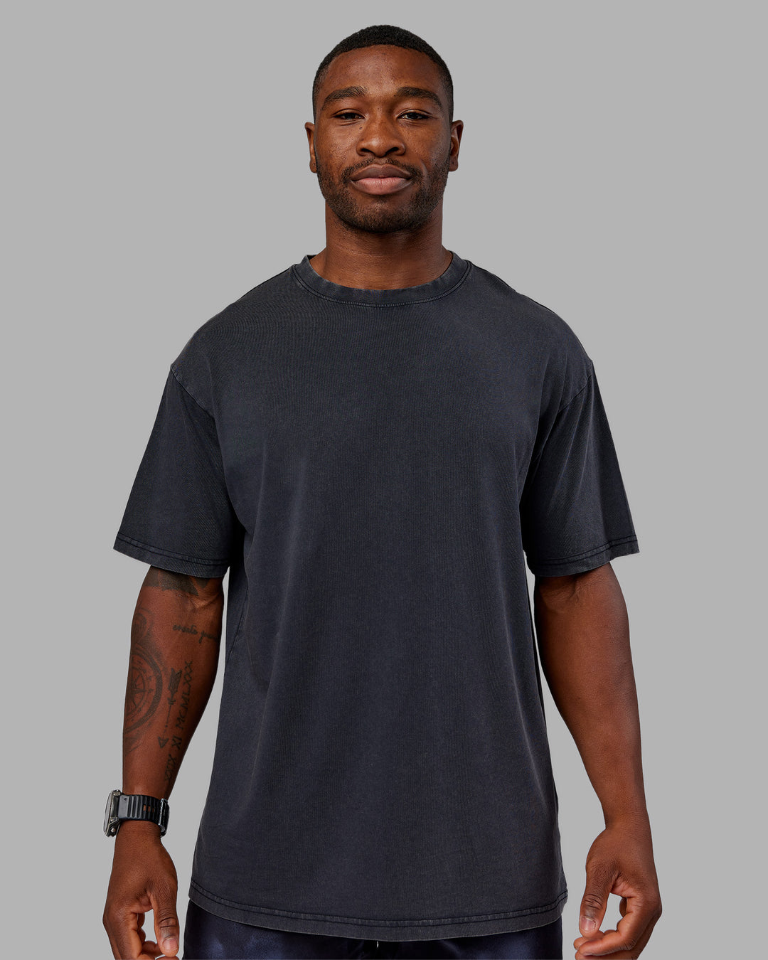 Man wearing Love The Run FLXCotton Tee Oversize - Black Washed-Circular Grey | Model:Sam | Size:L - view 4