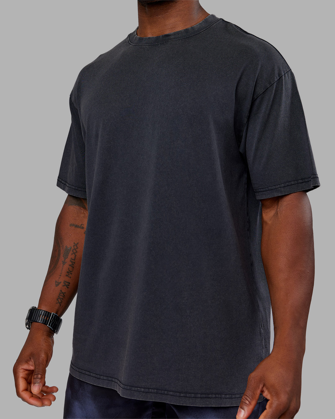 Man wearing Love The Run FLXCotton Tee Oversize - Black Washed-Circular Grey | Model:Sam | Size:L - view 10