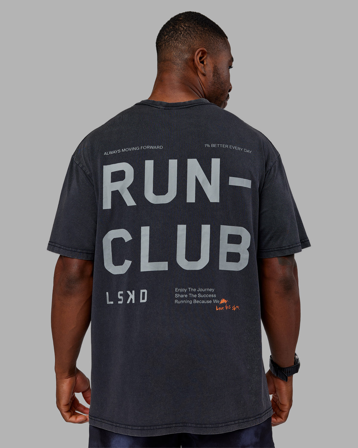 Man wearing Love The Run FLXCotton Tee Oversize - Black Washed-Circular Grey | Model:Sam | Size:L