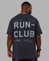 Man wearing Love The Run FLXCotton Tee Oversize - Black Washed-Circular Grey | Model:Sam | Size:L | Thumbnail Index: 1