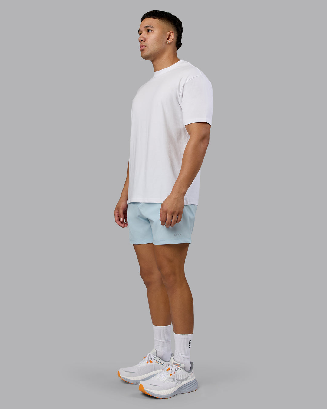 Man wearing Love The Run FLXCotton Tee Oversize - White-Dark Moss | Model:Kaelyb | Size:L - view 8