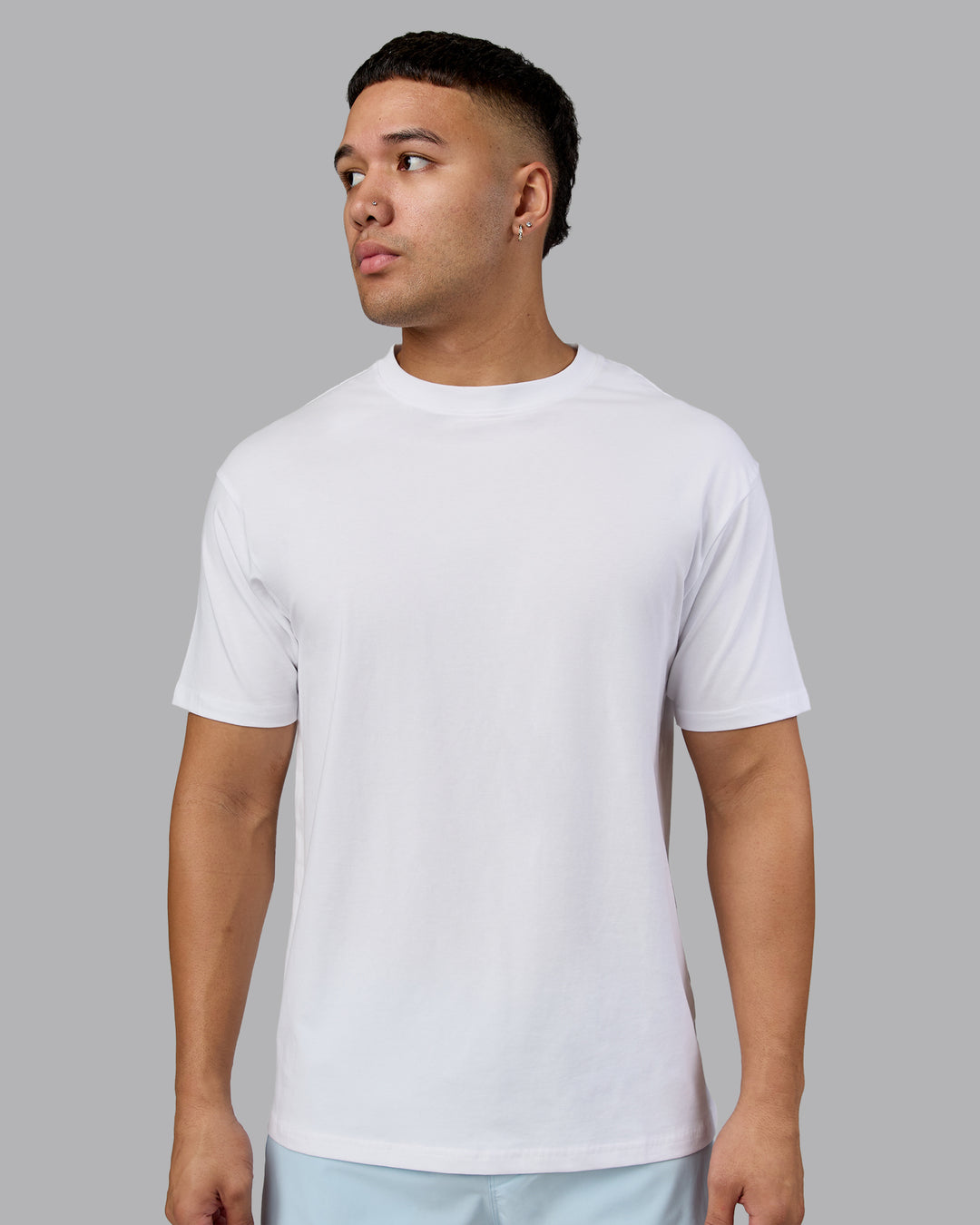 Man wearing Love The Run FLXCotton Tee Oversize - White-Dark Moss | Model:Kaelyb | Size:L - view 3