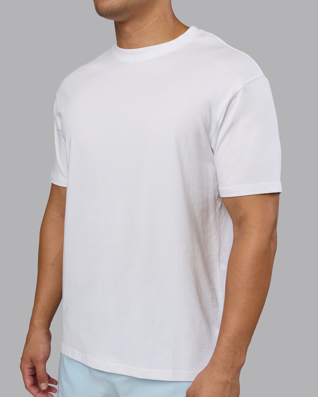Man wearing Love The Run FLXCotton Tee Oversize - White-Dark Moss | Model:Kaelyb | Size:L - view 9