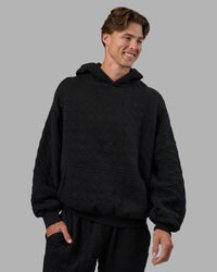 Man wearing MVP Quilted Oversized Hoodie - Black-Geometric | Model:Brandon | Size:L | Thumbnail Index: 8