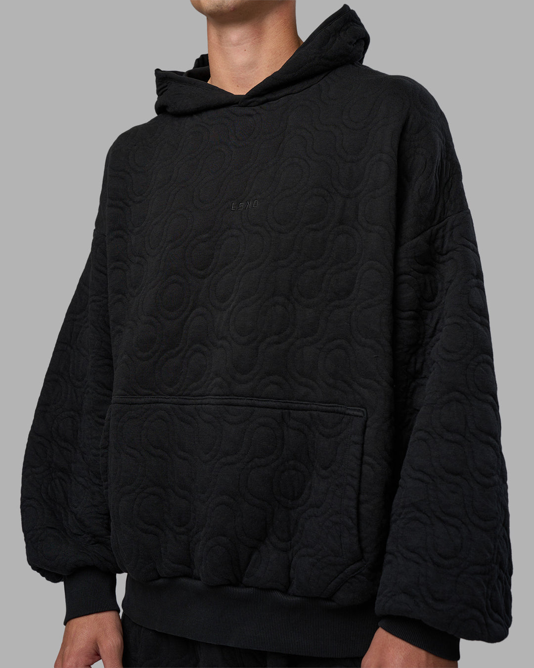 Man wearing MVP Quilted Oversized Hoodie - Black-Geometric | Model:Brandon | Size:L - view 8