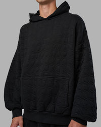 Man wearing MVP Quilted Oversized Hoodie - Black-Geometric | Model:Brandon | Size:L | Thumbnail Index: 7