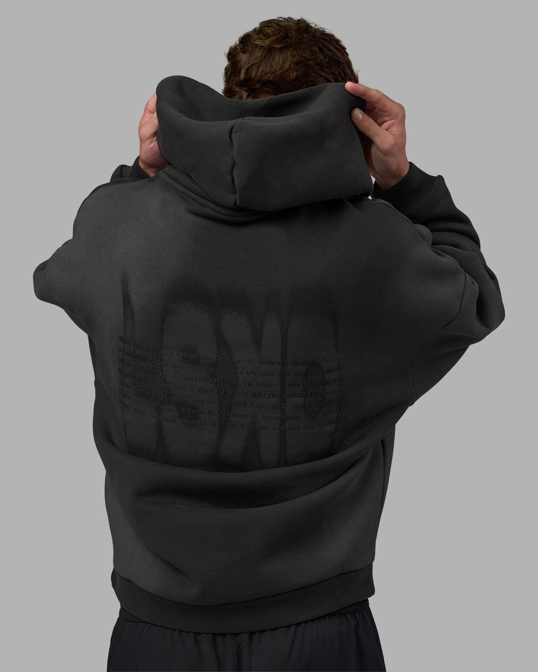 Man wearing Memory In Motion 500gsm Ultra Heavyweight Washed Hoodie - Charcoal Washed | Model:Brandon | Size:L - view 2