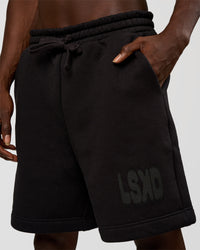 Man wearing Memory In Motion Heavyweight Fleece 7" Short - Black Washed | Model:Okello | Size:L | Thumbnail Index: 1