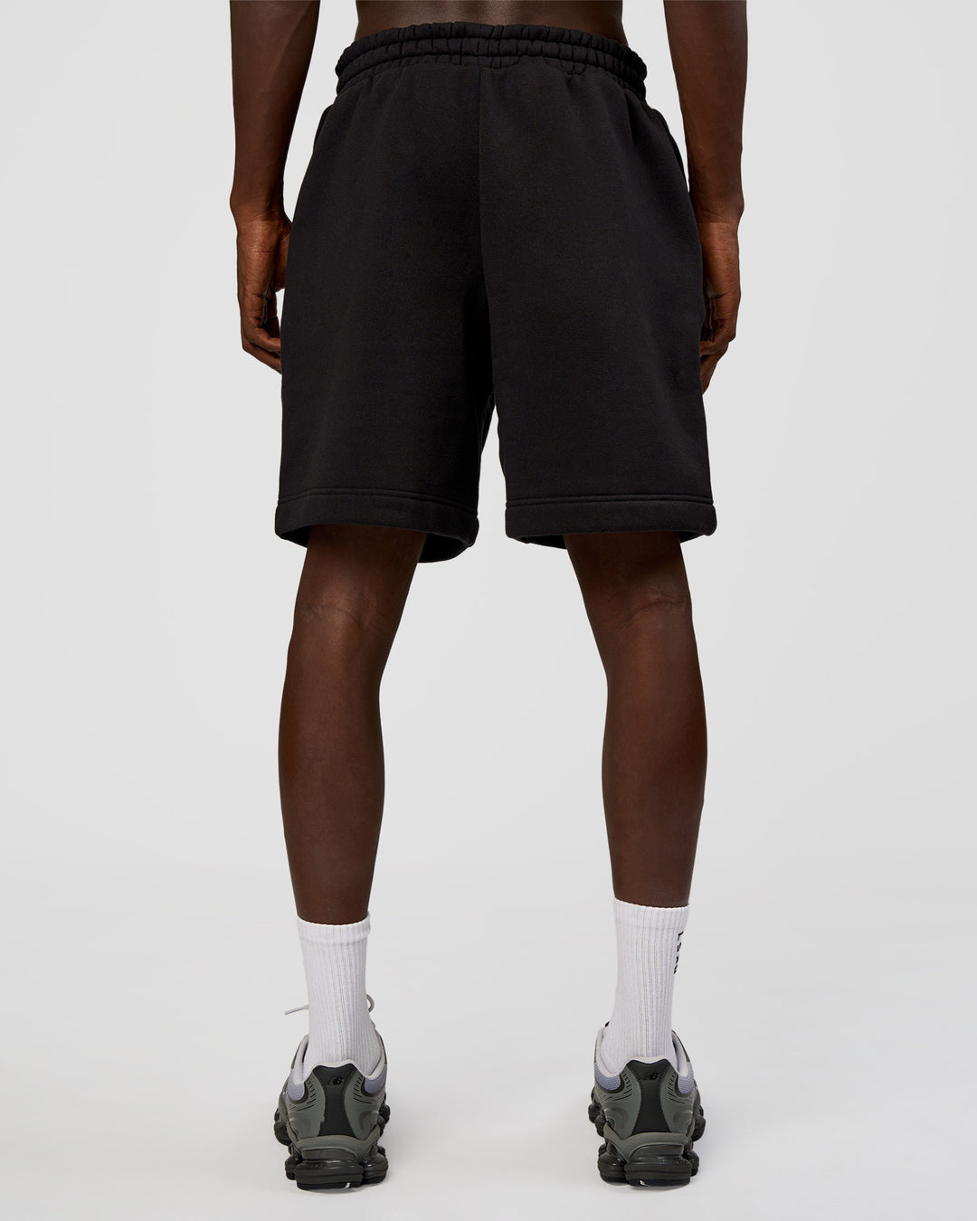 Man wearing Memory In Motion Heavyweight Fleece 7" Short - Black Washed | Model:Okello | Size:L - view 4