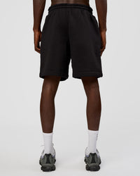 Man wearing Memory In Motion Heavyweight Fleece 7" Short - Black Washed | Model:Okello | Size:L | Thumbnail Index: 3