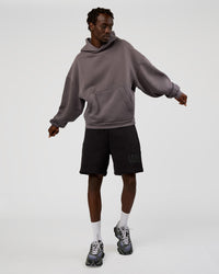 Man wearing Memory In Motion Heavyweight Fleece 7" Short - Black Washed | Model:Okello | Size:L | Thumbnail Index: 2