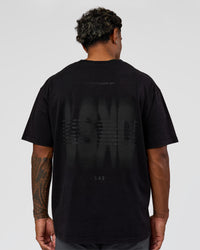 Man wearing Memory in Motion Heavyweight Oversized Tee - Black Washed | Model:Xav | Size:L | Thumbnail Index: 1
