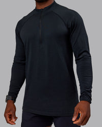 Man wearing AeroFLX+ Seamless Half Zip Long Sleeve Tee - Black/Black | Model:Sam | Size:L | Thumbnail Index: 4