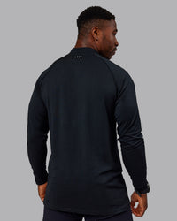 Man wearing AeroFLX+ Seamless Half Zip Long Sleeve Tee - Black/Black | Model:Sam | Size:L | Thumbnail Index: 3