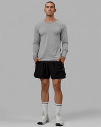 Man wearing AeroFLX+ Seamless Long Sleeve Tee - Light Grey Marl | Thumbnail Index: 5