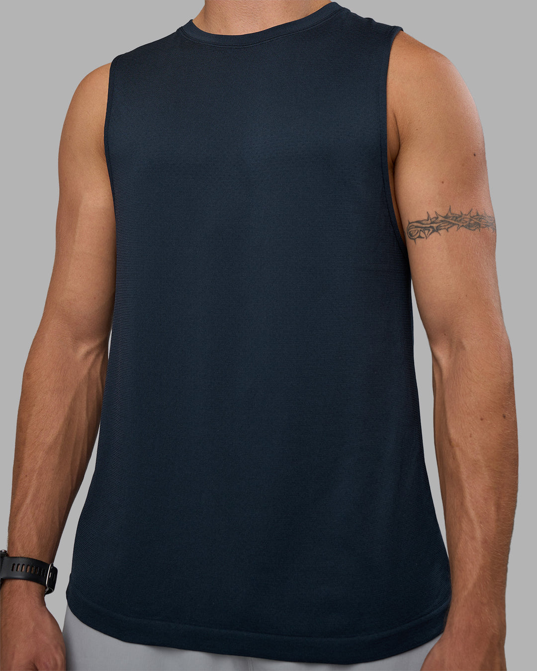 Man wearing AeroFLX+ Seamless Muscle Tank - Navy/Navy | Model:Nikola | Size:L - view 8