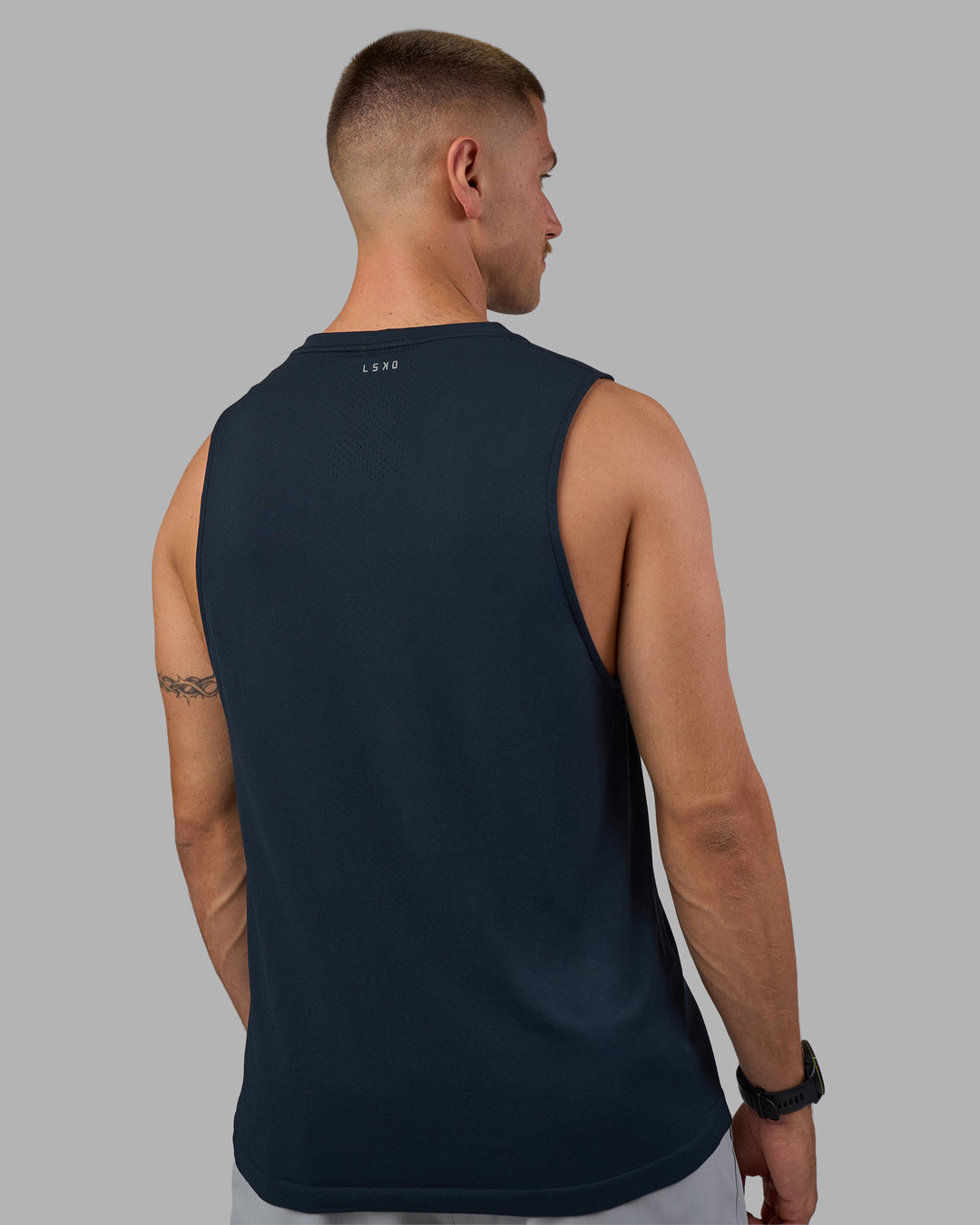 Man wearing AeroFLX+ Seamless Muscle Tank - Navy/Navy | Model:Nikola | Size:L - view 4