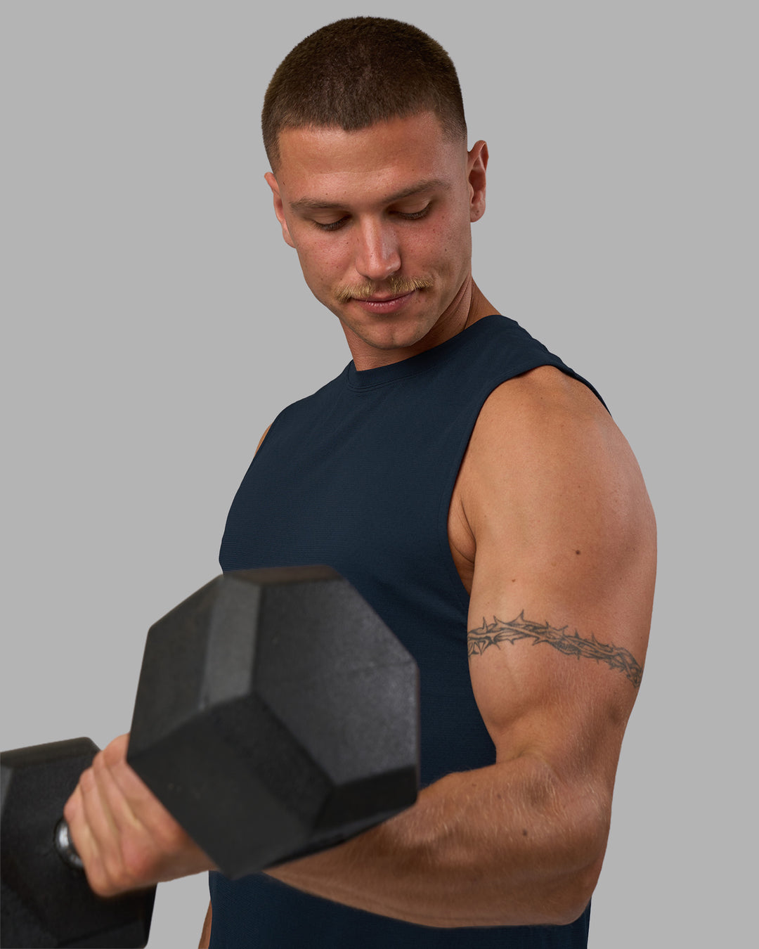 Man wearing AeroFLX+ Seamless Muscle Tank - Navy/Navy | Model:Nikola | Size:L - view 2