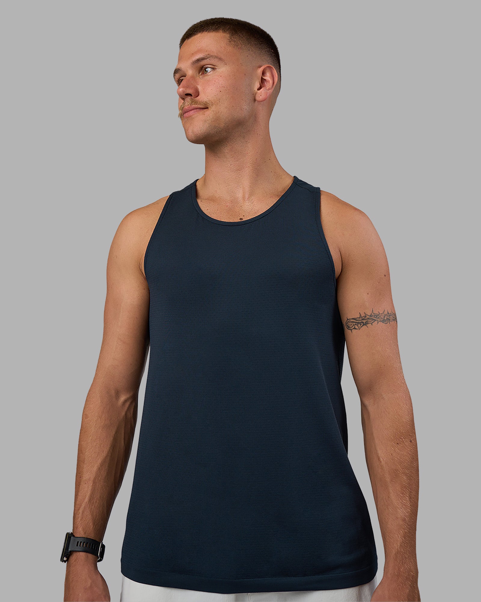 Man wearing AeroFLX+ Seamless Tank - Navy/Navy | Model:Nikola | Size:L