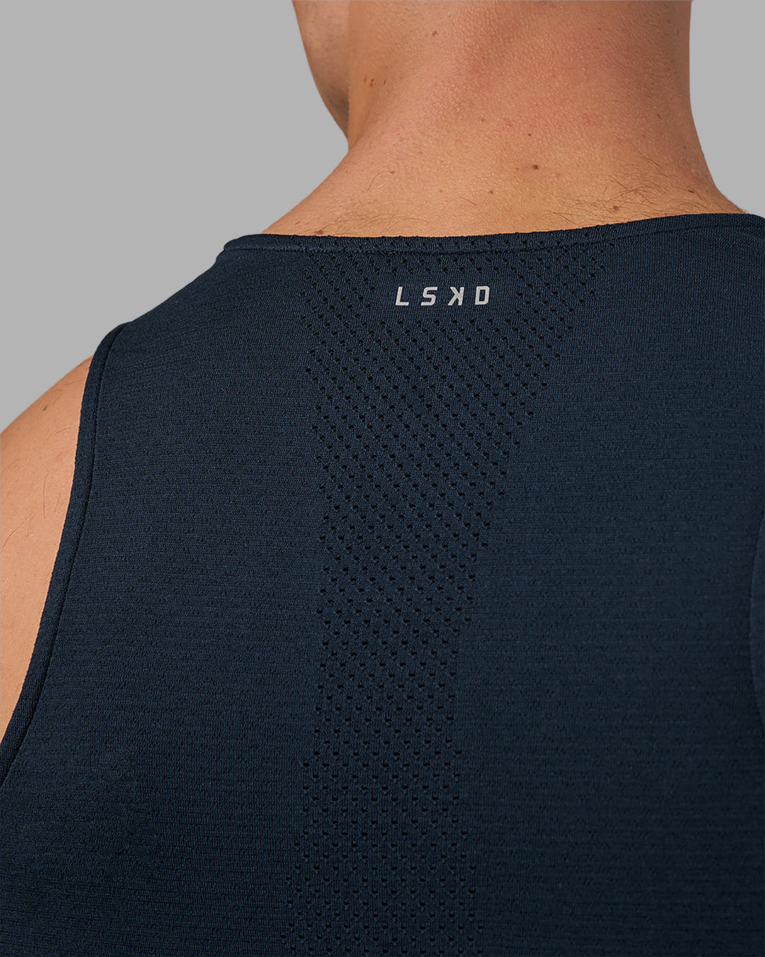 Man wearing AeroFLX+ Seamless Tank - Navy/Navy | Model:Nikola | Size:L - view 2