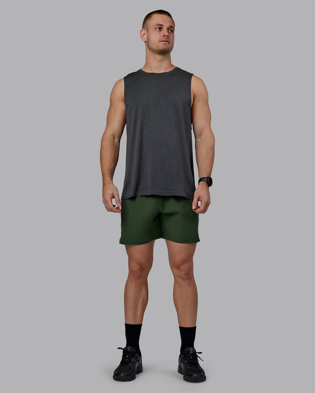 Man wearing AeroFLX+ Seamless Muscle Tank - Pirate Black Marl - view 1