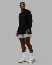 Man wearing Base FLXCotton Long Sleeve Tee - Black | Model:Sam | Size:L | Thumbnail Index: 1