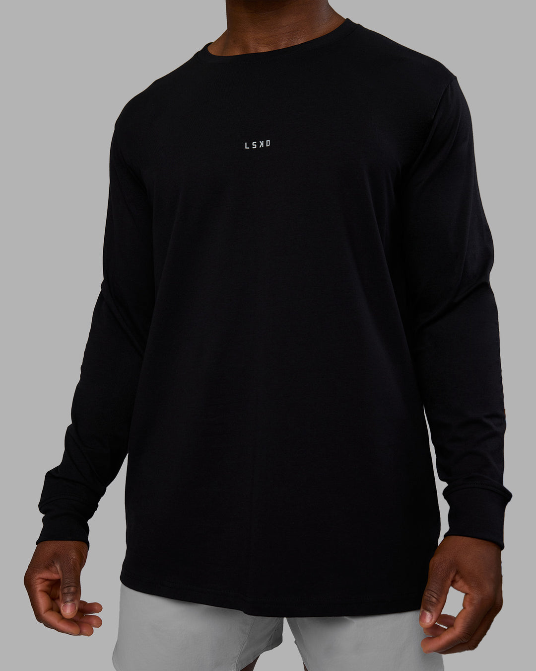 Man wearing Base FLXCotton Long Sleeve Tee - Black | Model:Sam | Size:L - view 5