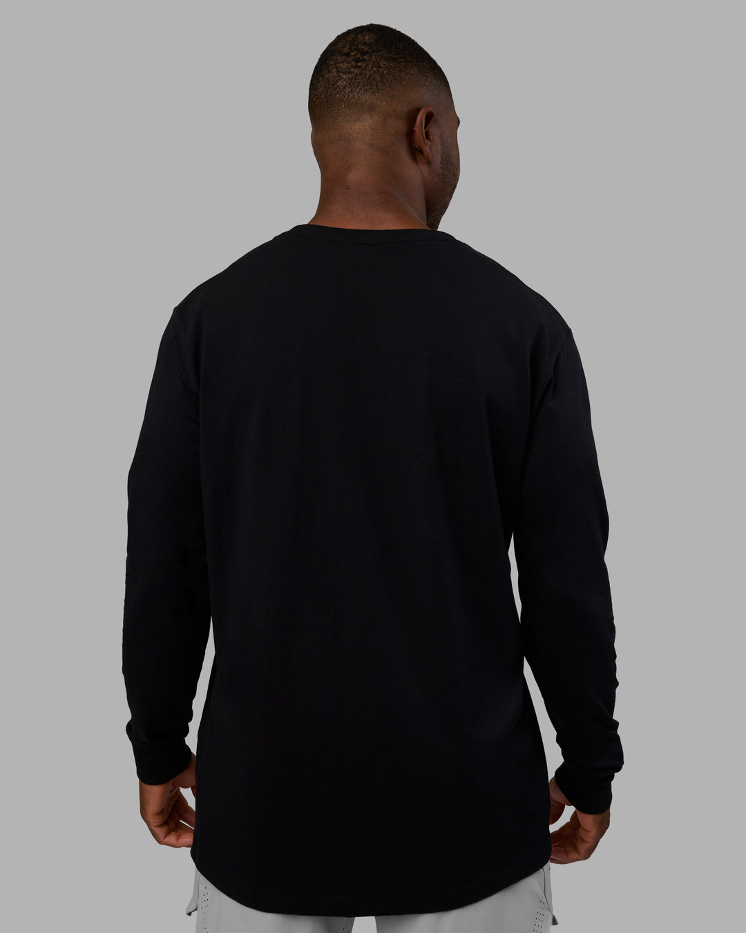 Man wearing Base FLXCotton Long Sleeve Tee - Black | Model:Sam | Size:L - view 3