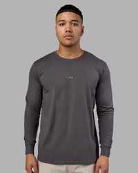Man wearing Base FLXCotton Long Sleeve Tee - Dark Storm | Model:Kaelyb | Size:L | Thumbnail Index: 0
