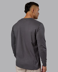 Man wearing Base FLXCotton Long Sleeve Tee - Dark Storm | Model:Kaelyb | Size:L | Thumbnail Index: 2
