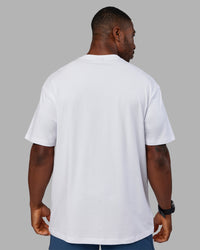 Man wearing Base FLXCotton Tee Oversized - White | Model:Sam | Size:L | Thumbnail Index: 2