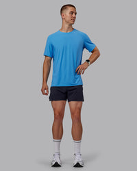 Man wearing Cadence Tee - Azure Blue | Thumbnail Index: 4