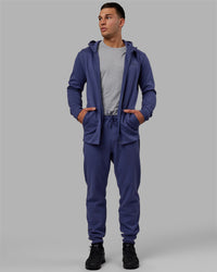 Man wearing Athlete ForgedFleece Zip Track Pants - Future Dusk | Thumbnail Index: 1