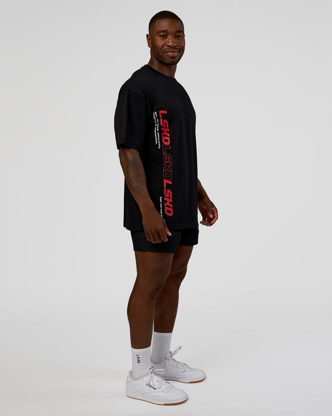 Man wearing Nothing Is Impossible FLXCotton Oversized Tee - Black-Flame | Model:Sam | Size:L - view 10