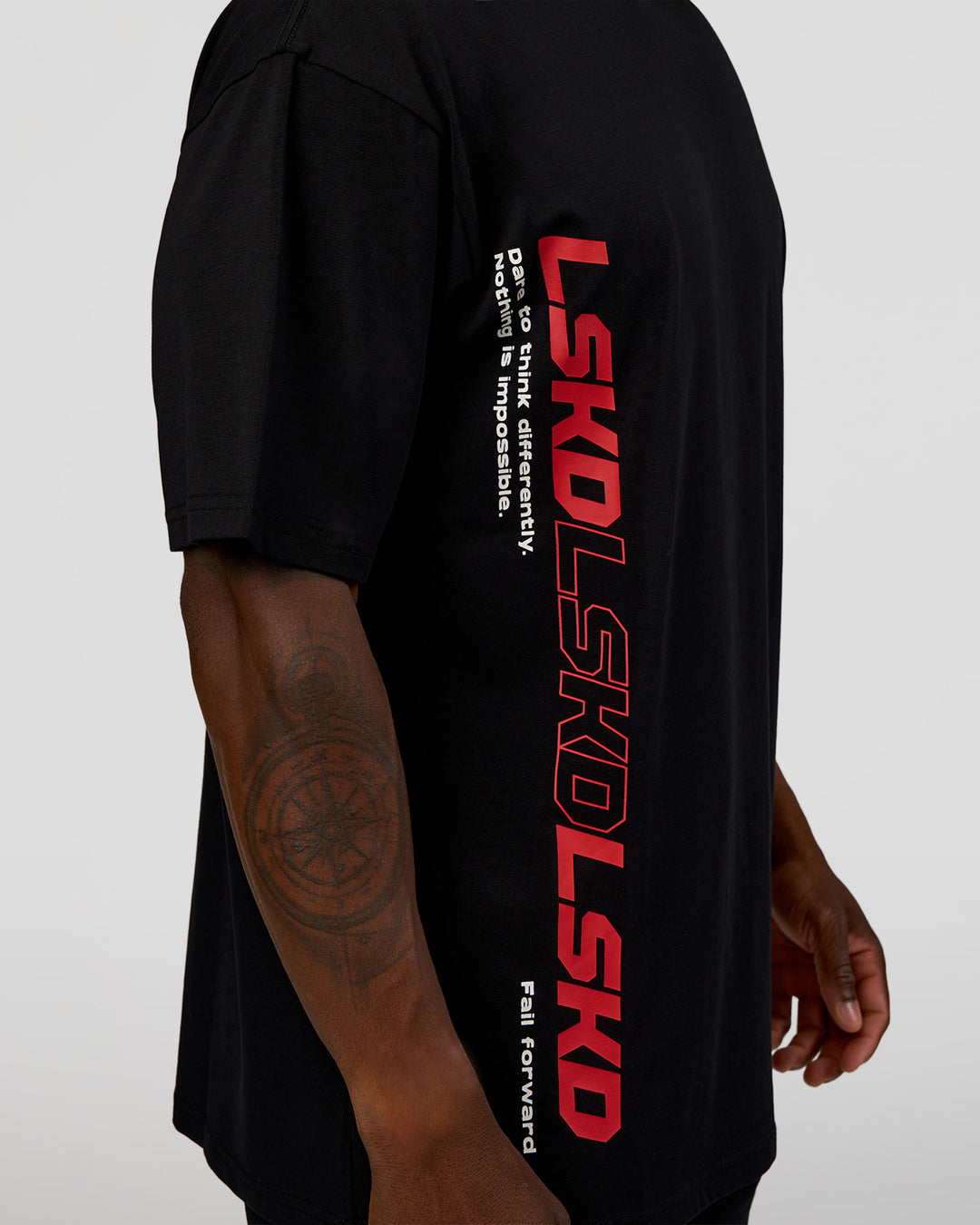 Man wearing Nothing Is Impossible FLXCotton Oversized Tee - Black-Flame | Model:Sam | Size:L - view 3