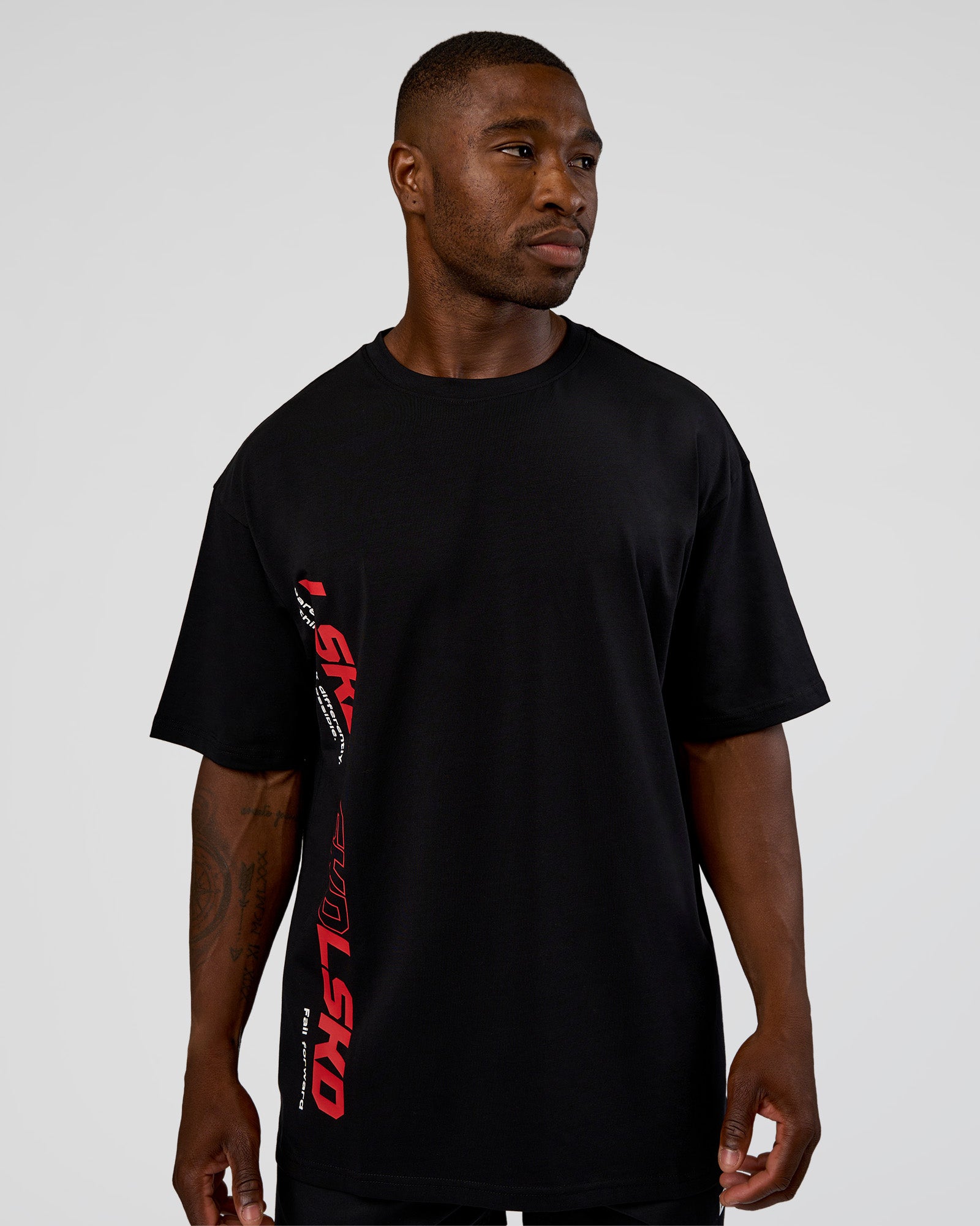 Man wearing Nothing Is Impossible FLXCotton Oversized Tee - Black-Flame | Model:Sam | Size:L
