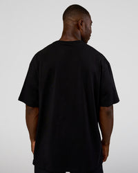 Man wearing Nothing Is Impossible FLXCotton Oversized Tee - Black-Flame | Model:Sam | Size:L | Thumbnail Index: 6
