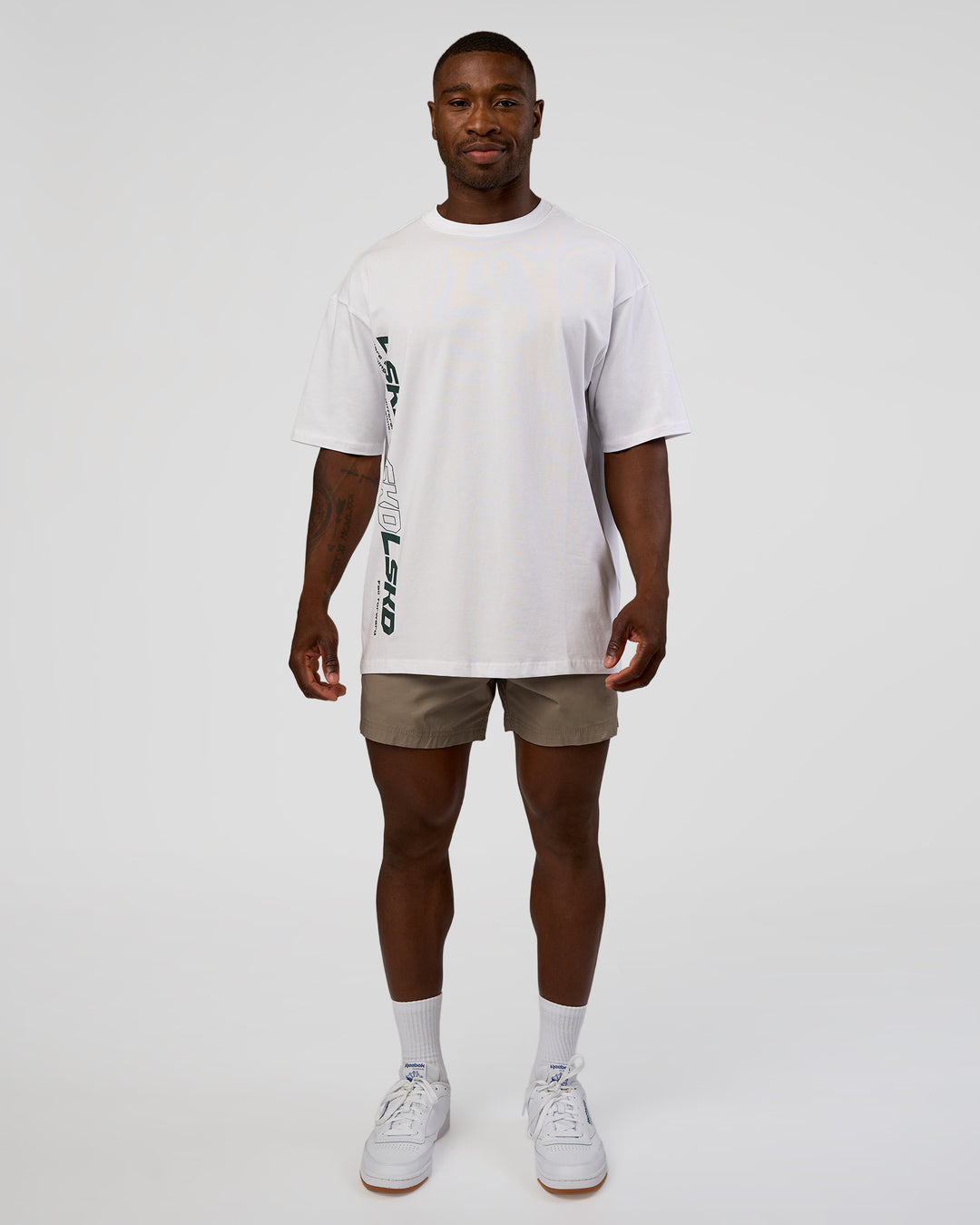 Man wearing Nothing Is Impossible FLXCotton Oversized Tee - White-Vital Green | Model:Sam | Size:L - view 3